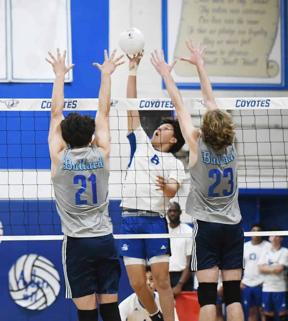 Volleyball players in action during a game at Madera High School.