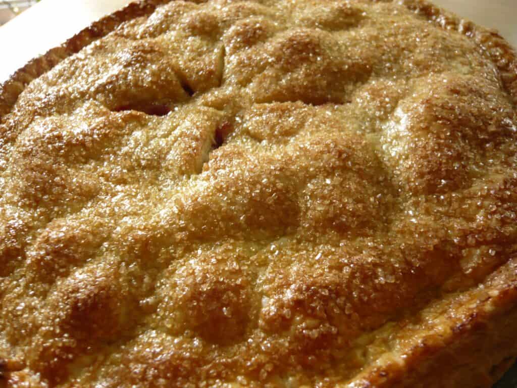 Apple pie with a golden, flaky crust and sweet filling.
