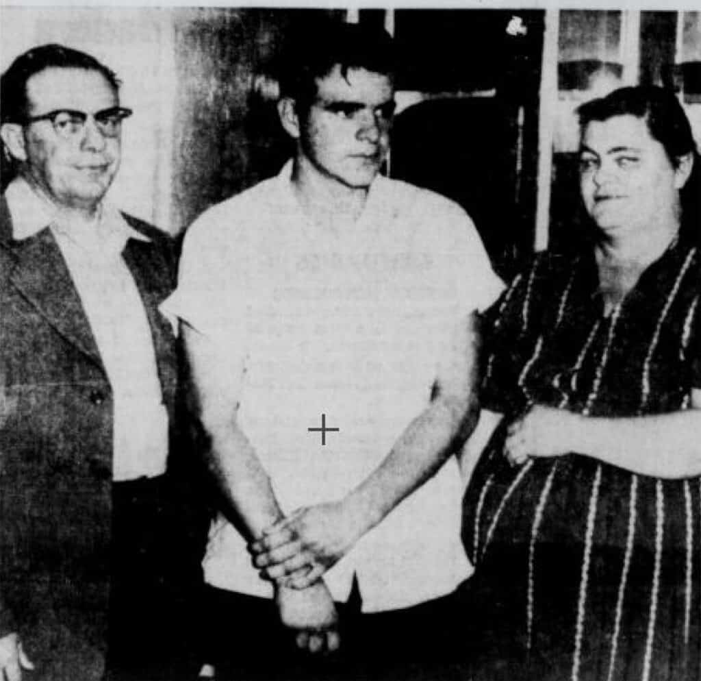Historical photo of three people in a meeting or event in Madera.
