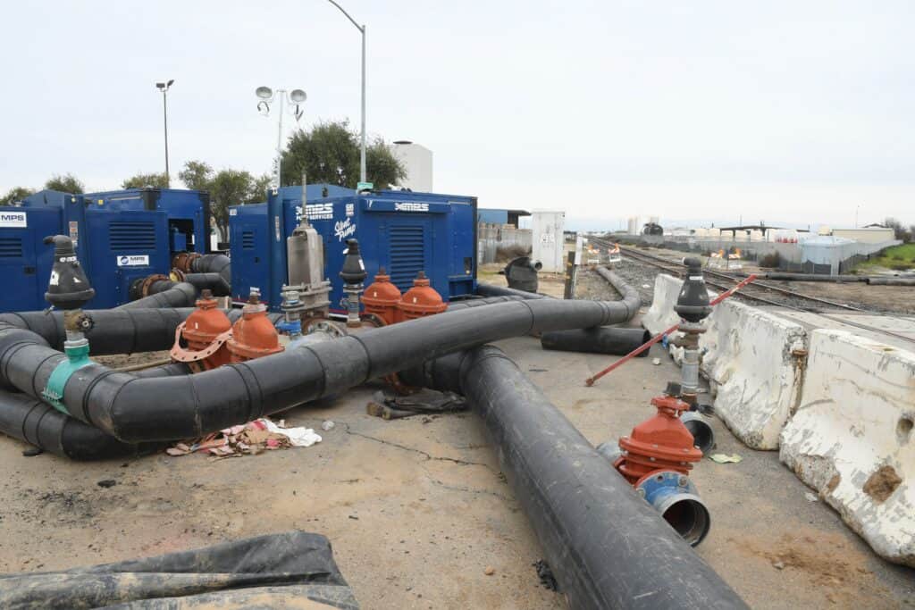 Water pipes and pumps on a construction site in Madera County.