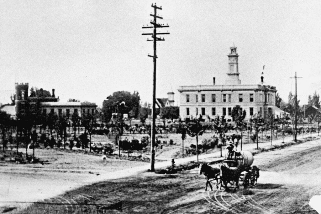 Historic image of Madera County Courthouse and town square.