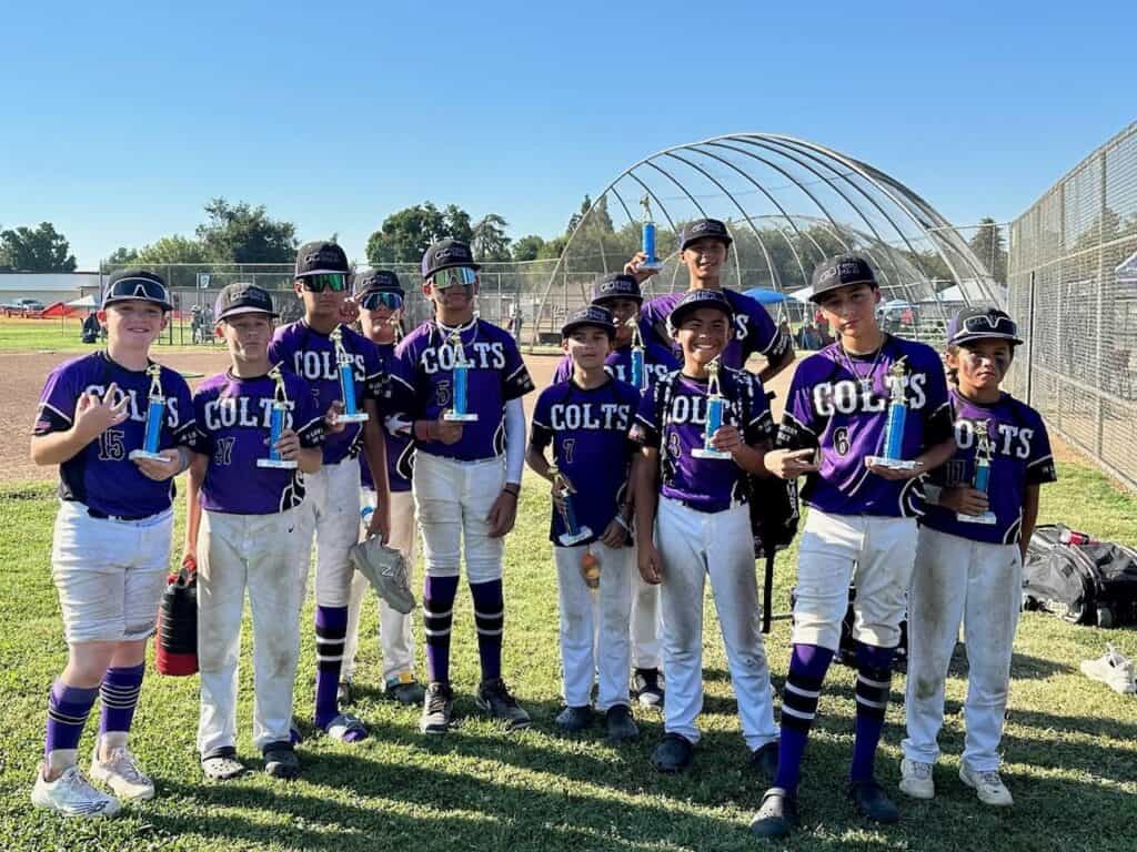Photo - The South County Colts 12-under travel baseball team show off the trophies they won by capturing a tournament championship in Visalia after going 4-1 from August 5-6.