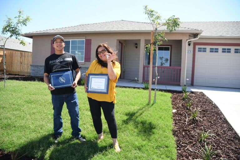 Families receive keys to homes