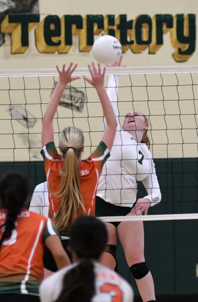 Photo - Liberty’s Zoey Richey rises up for a kill during a four-set victory over Porterville on Tuesday.