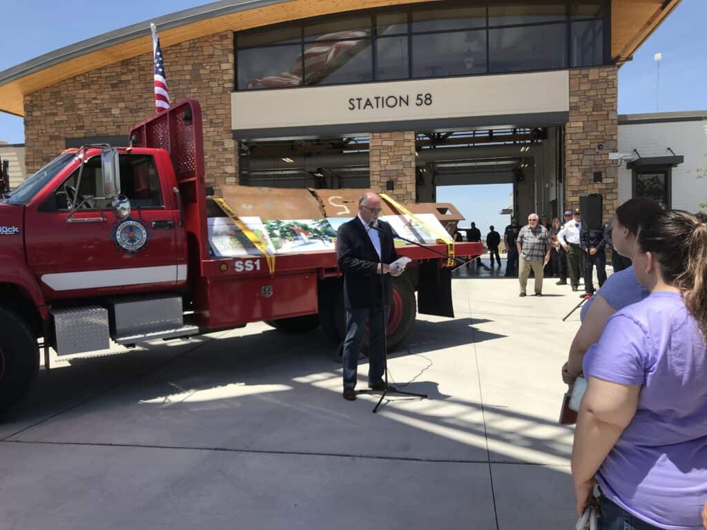 Fire truck display at Madera Station 58 with community members.