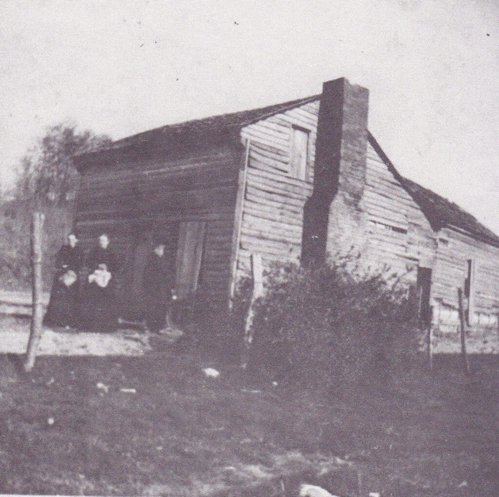 Old wooden house with a chimney in Madera, California.