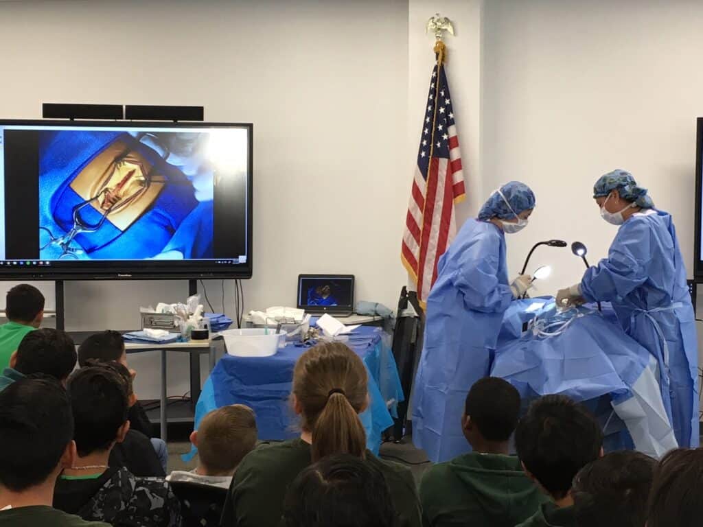 Medical students learn surgical techniques during a hands-on training session.