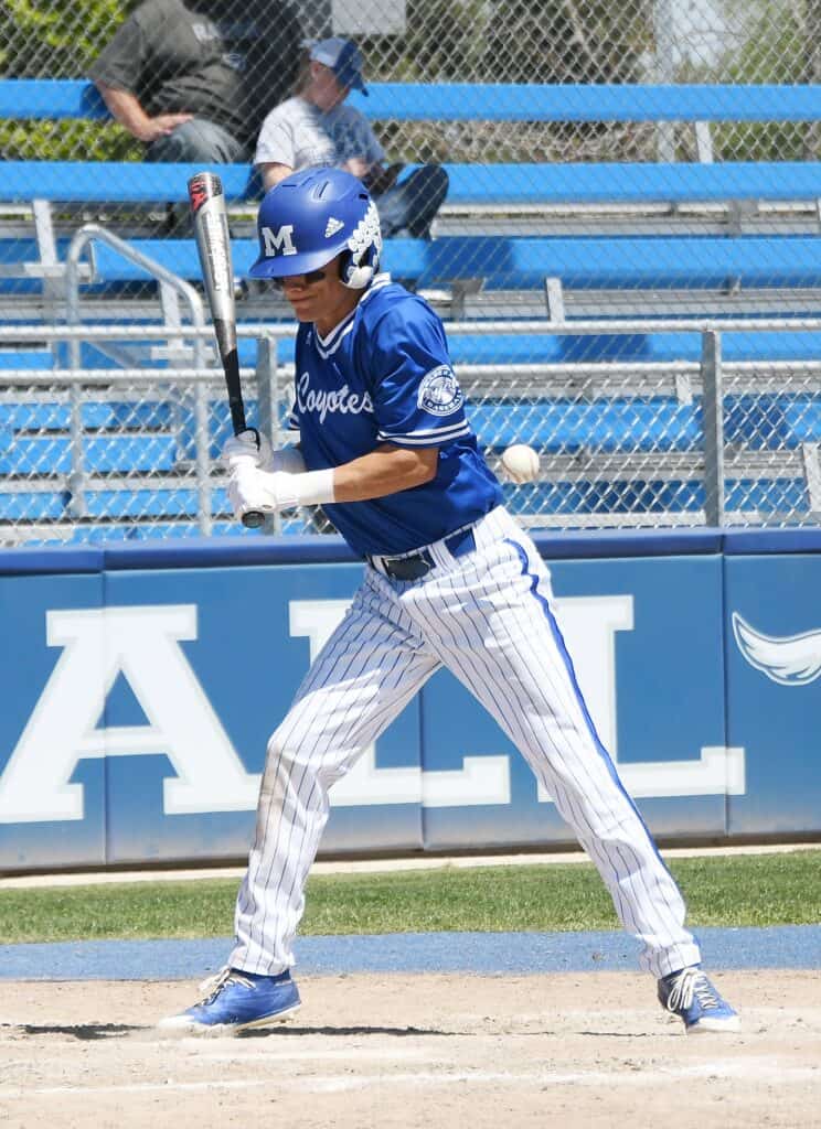 Madera baseball player preparing to hit during game at the stadium.