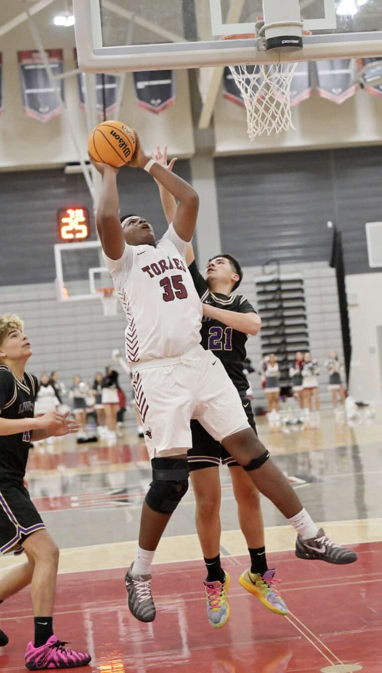 Torres shoots way to season opening win
