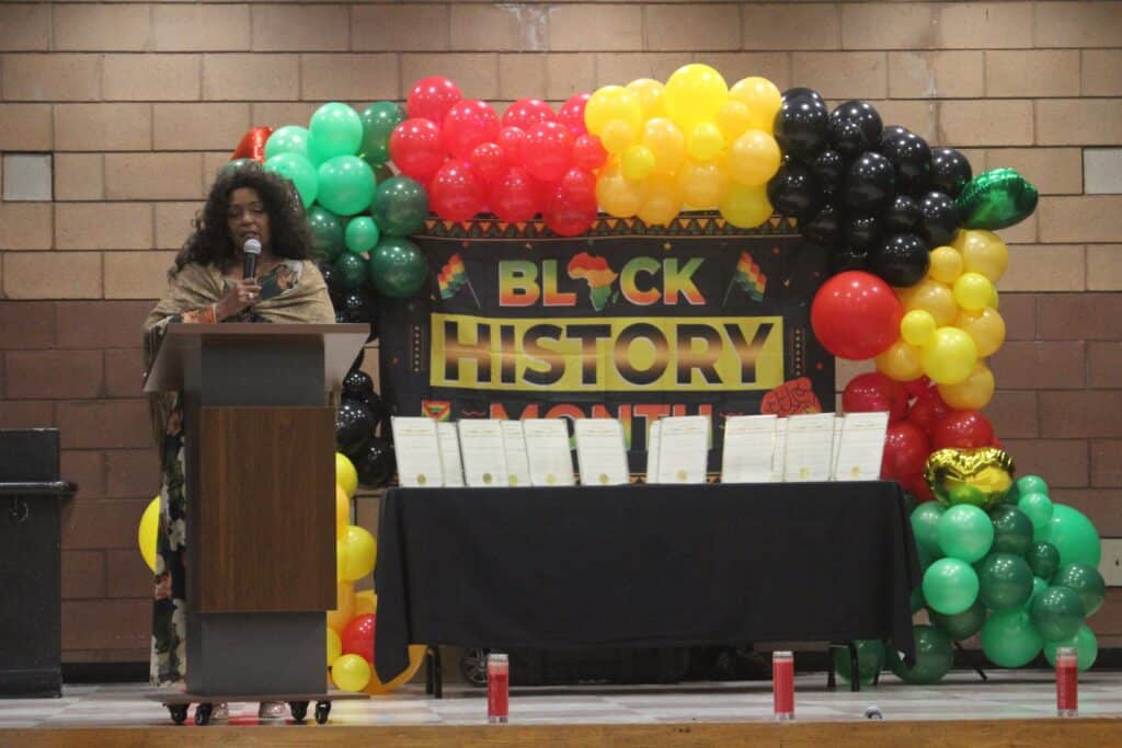 Photo of Madera City Councilwoman Anita Evans welcomes guests at the City of Madera Black History Month Celebration last year at the Pan Am Center.