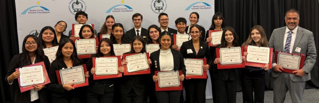 Photo of The Matilda Torres High School Mock Trial team show off their participation certificates before winning the Madera County Mock Trial event, defeating Madera South in the championship round.