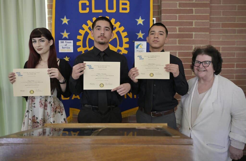 Photo of Madera Rotary Speech contest winners from left, Jazzy Duque, Matthew Hernandez and Adriel Ornelas, joined by their teacher Betty Klein after receiving their certificates during a meeting.