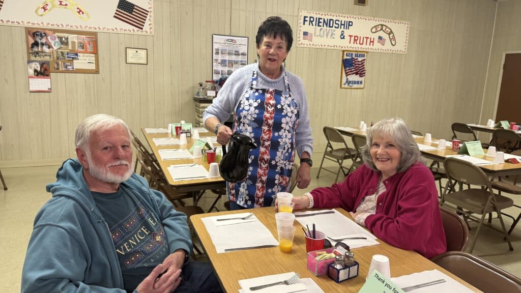 Photo of Hanna Lane, a member of the Odd Fellows Lodge 327, serves coffee at breakfast the third Saturday of each month. Pictured, from left are David Simpson, Lane, and Nancy Simpson.