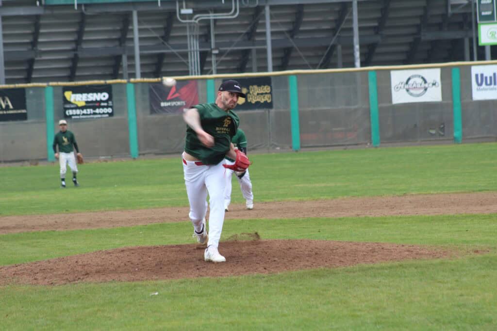 Photo of Cleveland Guardians’ free agent signee Connor Brogdon throws a pitch to Liberty varsity players during the Liberty Hawks’ Alumni game in January. Brogdon was the featured attraction, and didn’t disappoint. He struck out two with eight pitches in his inning of work, and even hit a single in his first plate appearances in about 10 years.