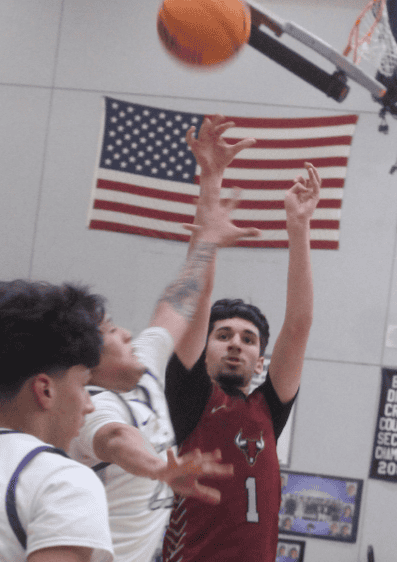 Photo of David Casas rises up for a mid-range Jumper during Tuesday’s win over Madera South. Casas scored 17 points with a pair of 3-pointers and went eight-for-eight from the free throw line to lead the Toros.