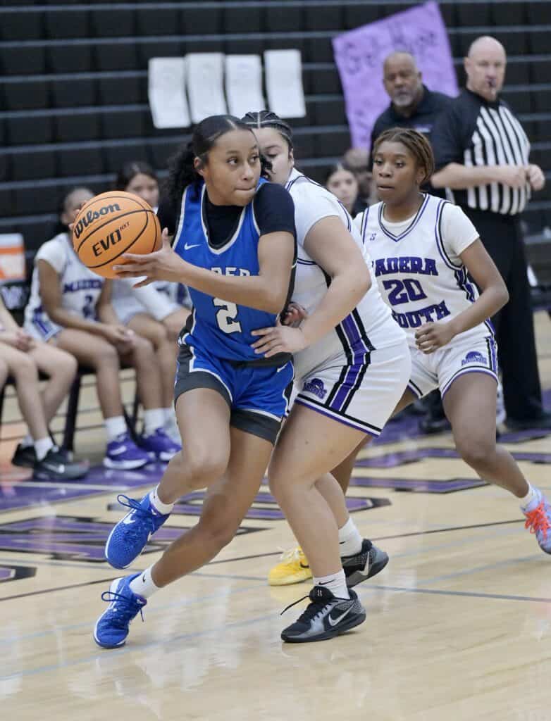 Photo of Madera freshman Janyah Spotwood drives to the hoop during Friday’s victory over Madera South. Spotwood led the Coyotes with 13 points and 12 rebounds. 