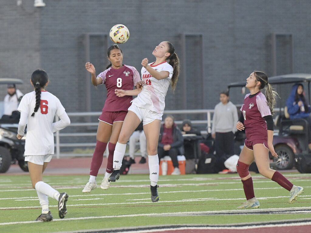 Photo of Matilda Torres’ Yamileth Hernandez (8) gets her head on the ball in the midfield during Wednesday’s battle with the Sanger Apaches. 