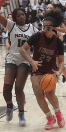 Photo of Matilda Torres’ J’Lynn Mitchell drives to the lane in Wednesday’s loss to Hoover.