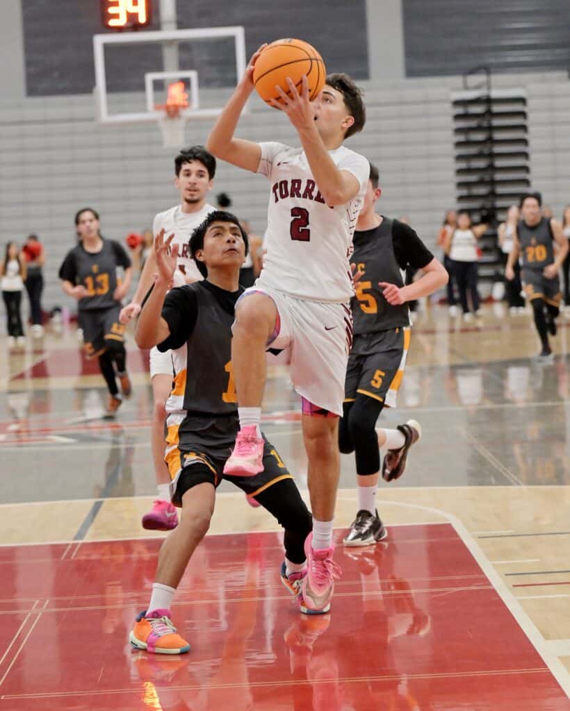 Photo of Matilda Torres’ Steven Jamison drives to the hoop to score two of his 12 points in Friday’s win over the Central Grizzlies. He had a team-high five steals in forcing 37 Central turnovers in the blowout. 