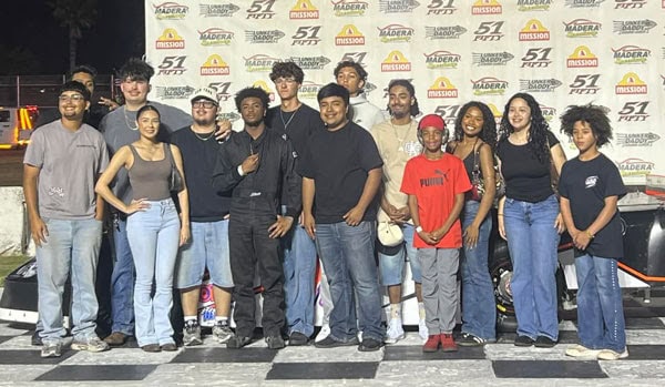 For The Madera Tribune Madera’s Joseph Holiday, middle back, stands at victory lane with his crew and family after winning the season opener of the Pro Sportman division at the Madera Speedway on Saturday.
