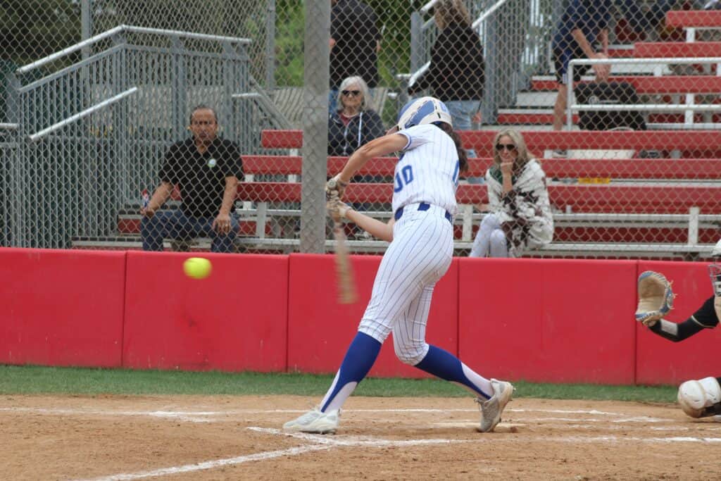 Photo of Madera’s Destinee Avila rips one of her two doubles in Tuesday’s victory over Liberty. She drove in four runs in the win. 