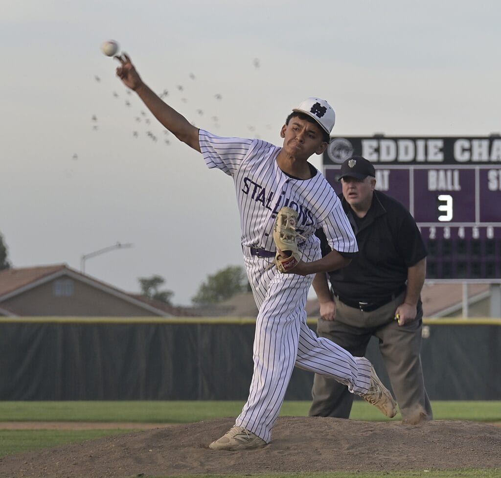 Photo of Madera South’s Victor Mercado throws a pitch during Thursday’s victory over Matilda Torres. Mercado struck out 10 and scattered five hits in a complete game victory. He also scored two of the Stallions’ five runs in the win. 