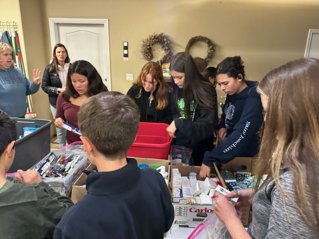 Photo - Howard 4-H members create toiletry bags to donate to the Madera Rescue Mission during its April monthly meeting.