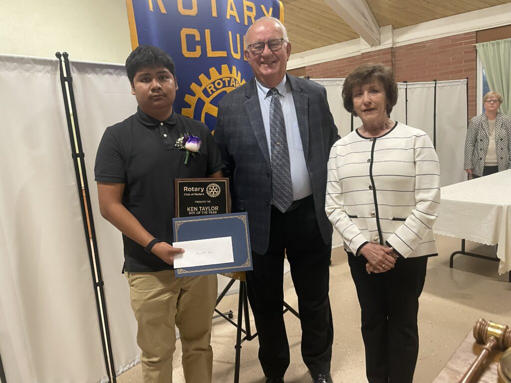 Photo - Ken Taylor Boy of the Year Pablo Giron-Lopez of Madera South High School is presented with his award by Ken Taylor’s family, Ron and Terri Pisk.