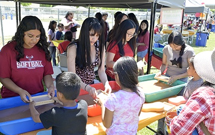 Photo - Volunteers for the Madera Artist Friends group make paper out of recycled material with attendees during last year’s Arts Fest hosted by Madera County Schools Foundation and Madera County Superintendent of Schools and sponsored by EECU.