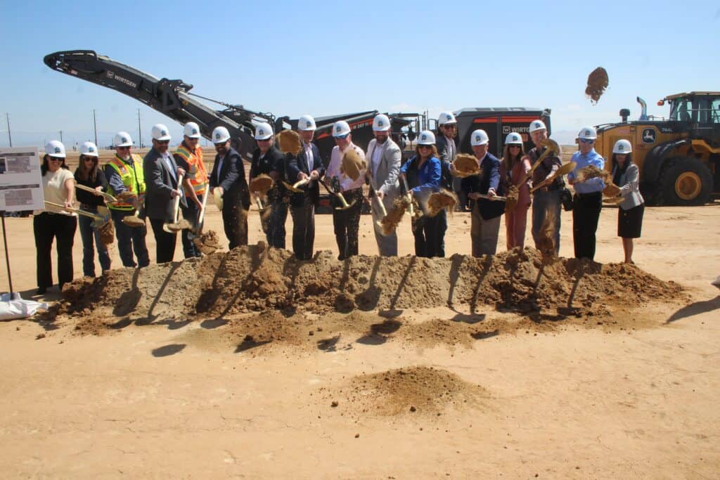 Photo - Local dignitaries shovel dirt for the official groundbreaking for the SR 41 expansion ceremony on Friday.