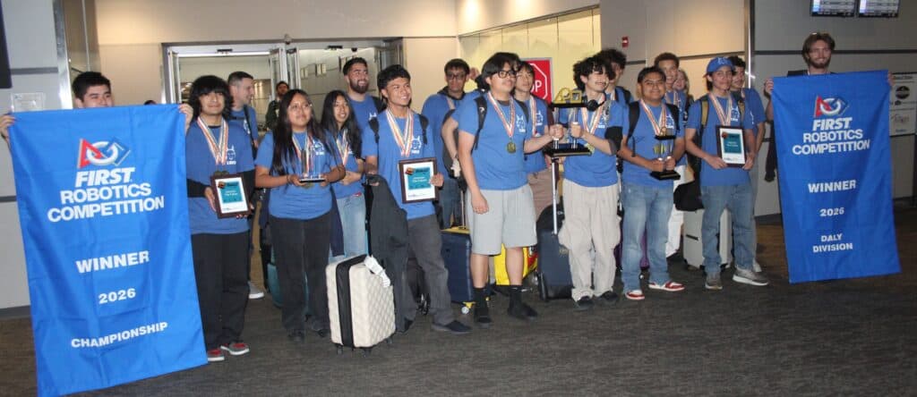 Photo - The MadTown Robotics team arrives at Fresno Yosemite International Airport to a huge welcome from family and friends after winning a fourth World Championship over the weekend.