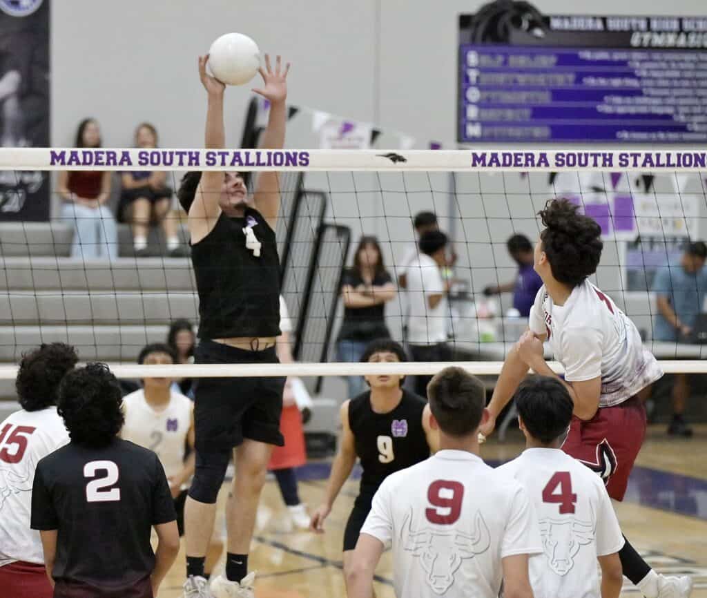Photo - Madera South’s Douglas Fuentes rises above the net for a block on a Matilda Torres attack during Thursday’s sweep over the Toros. Fuentes led the Toros with 13 kills.