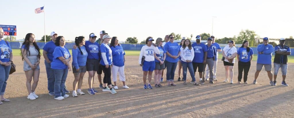 Photo - Madera Coyotes retiring softball coach Judy Shaubach, middle with microphone, acknowledges the many coaches that have helped in her 38 years at Madera while amassing 780 victories after Thursday’s victory over Edison in Madera’s regular season finale.