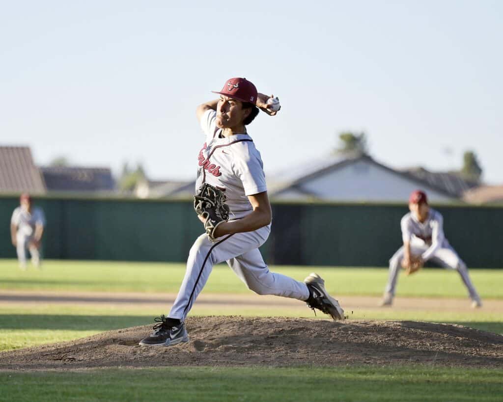 Photo - Matilda Torres’ Jose Velazquez throws a pitch during Friday’s game with Madera South. Velazquez allowed four runs, one earned, over six innings to pick up the win. He struck out seven and walked three.