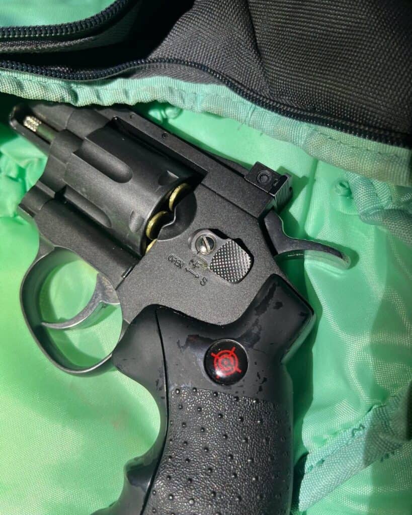 Photo - A handgun was among two firearms found in a traffic collision that stemmed from speeding early Friday morning.