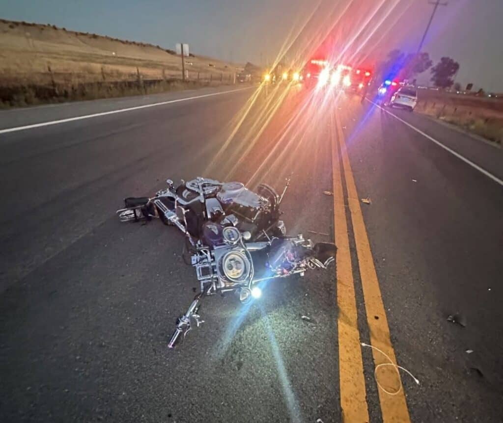 Photo - A Harley Davidson motorcycle sits in the middle of the roadway after it ran into a car attempting a U-turn at State Route 41, north of SR 145. The driver of the motorcycle died from his injuries.