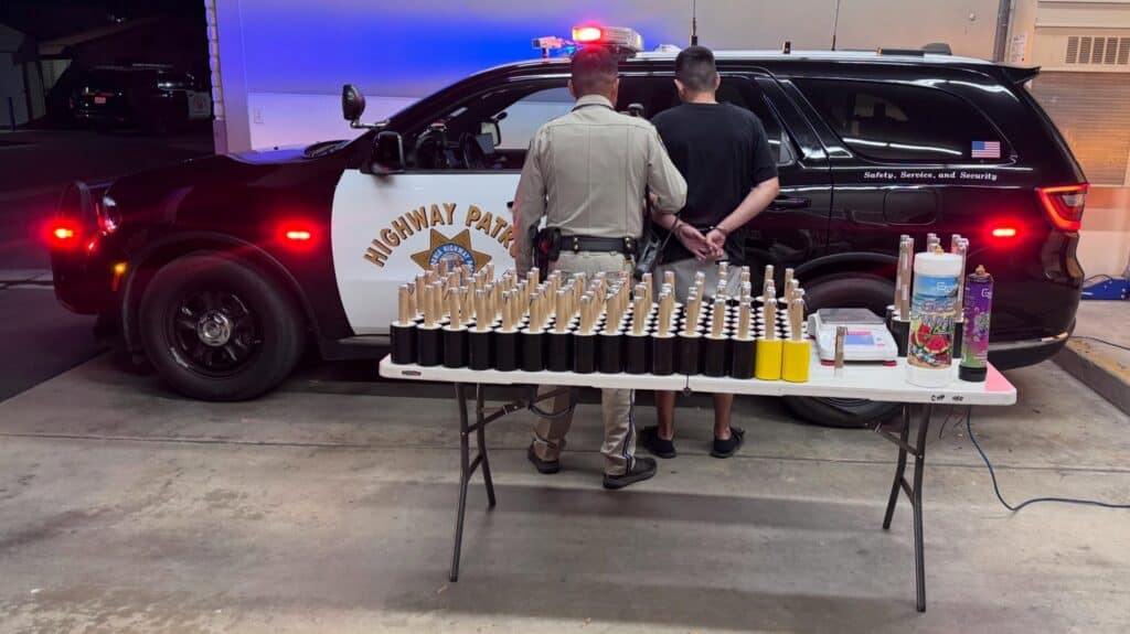 Photo - Madera CHP takes a suspect into custody. Originally, the suspect was arrested on DUI, but during a search of his vehicle, officers found nitrous oxide tanks and illegal fireworks.