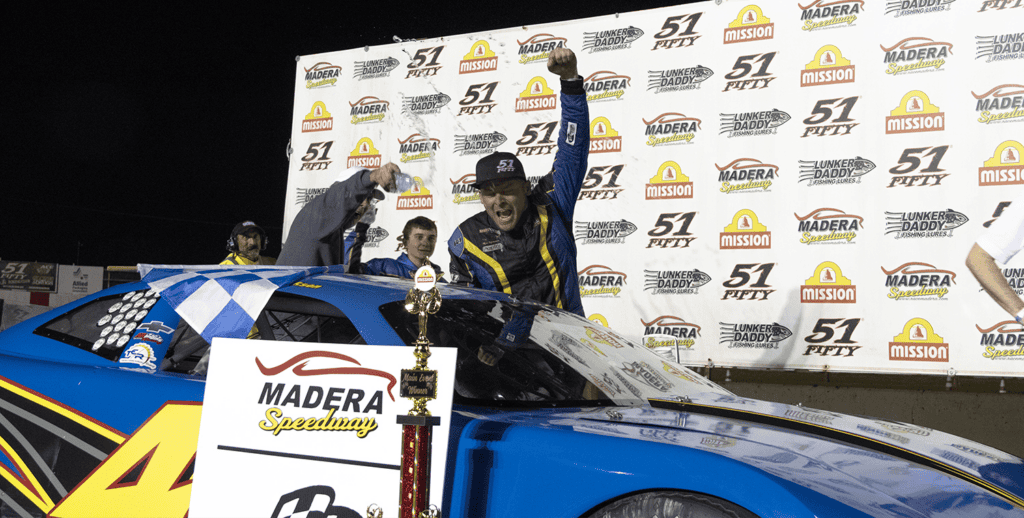 Erickson celebrates winning the Late Models race at Madera Speedway.