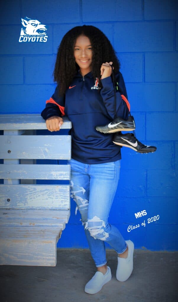Young female student athlete in Madera High School gear at CSU Fullerton event.