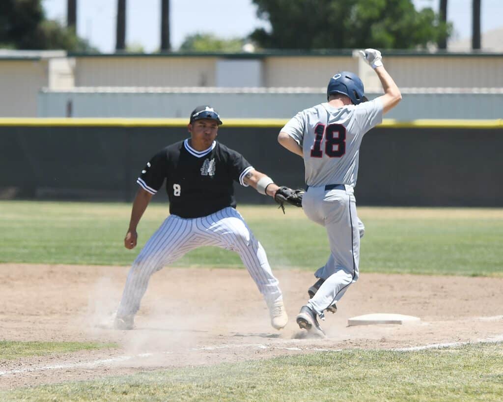 Stallions player slides into second base during a game against Panthers.