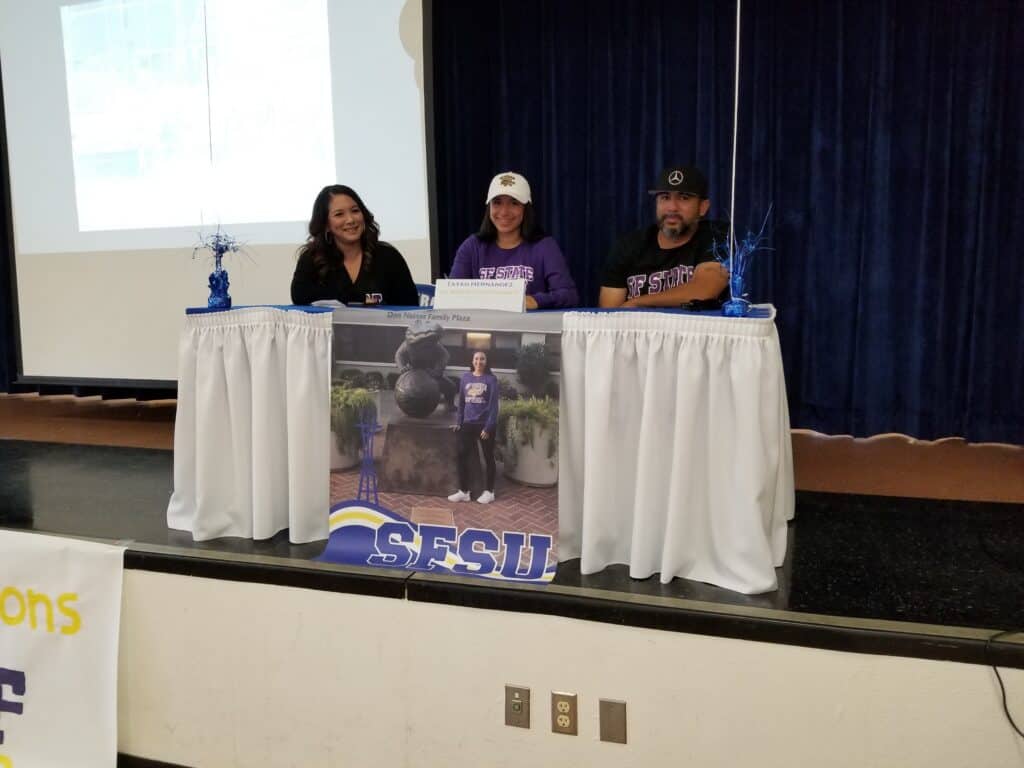 Scholarship award ceremony featuring student athlete at Madera Tribune event.