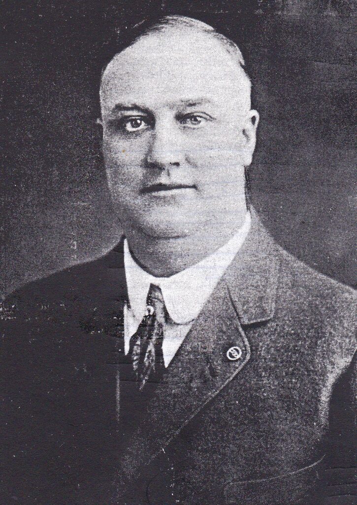 Black and white photo of a man in a suit from 1926 Madera politics.
