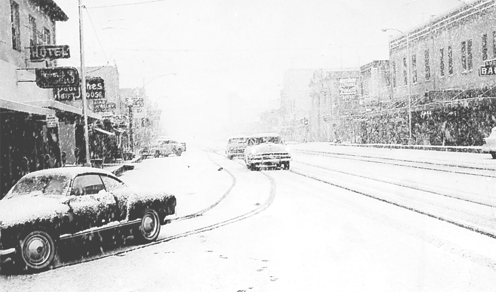 Snow-covered street in Madera during a winter storm.