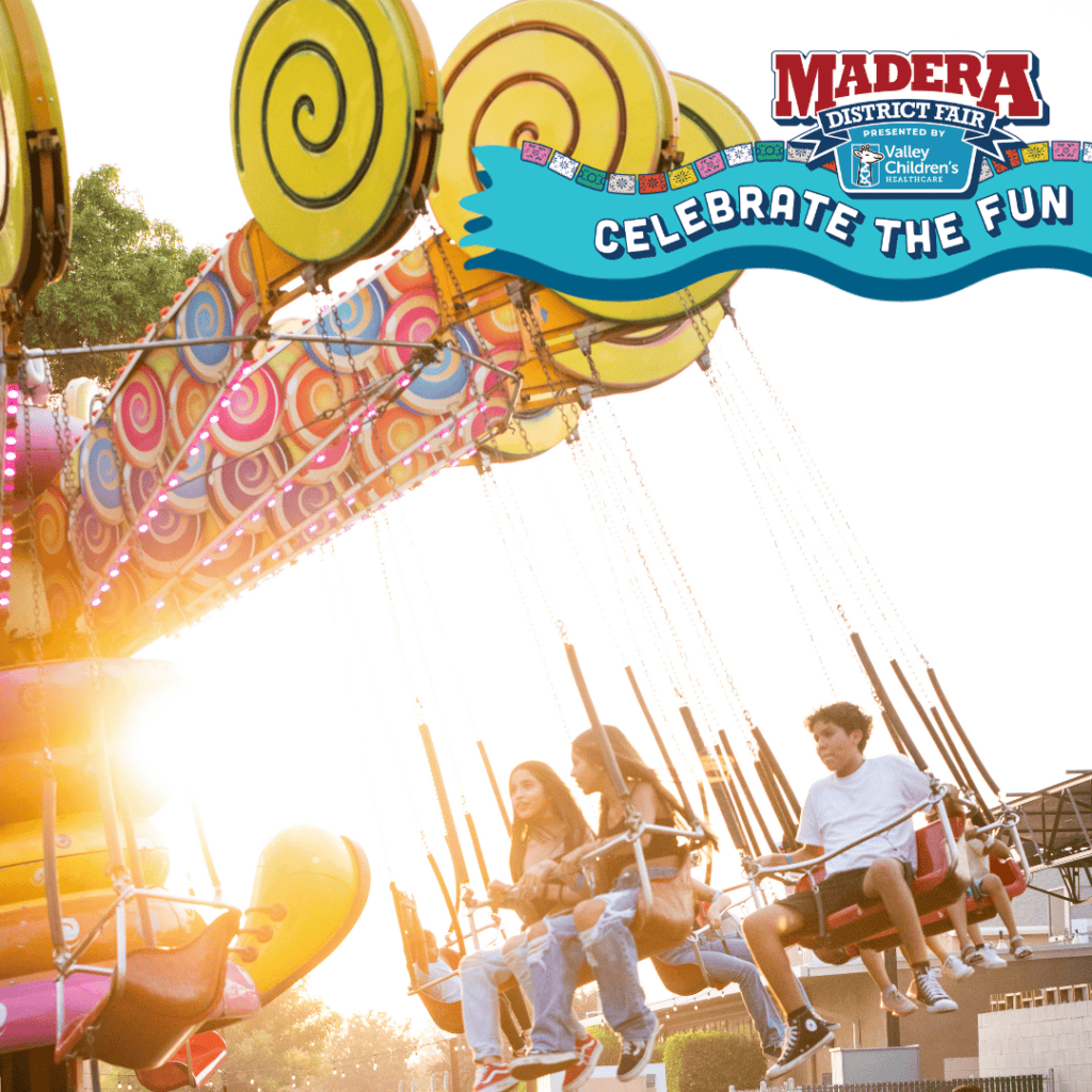Amusement rides at Madera Fair with children enjoying the fun.