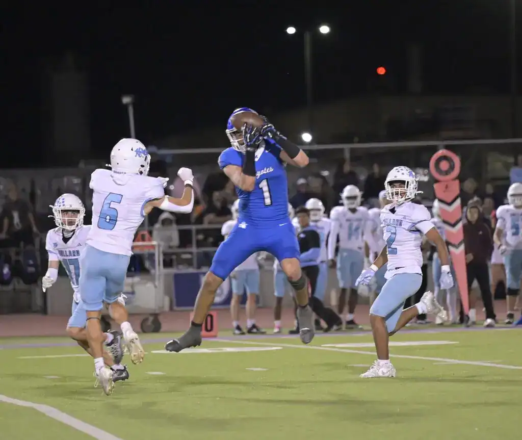 Photo - Madera’s Jayden Martinez makes a tough catch over the middle during Friday’s loss to the Bullard Knights. Martinez scored four of Madera’s five touchdowns in the loss, and caught six passes for 181 yards. 