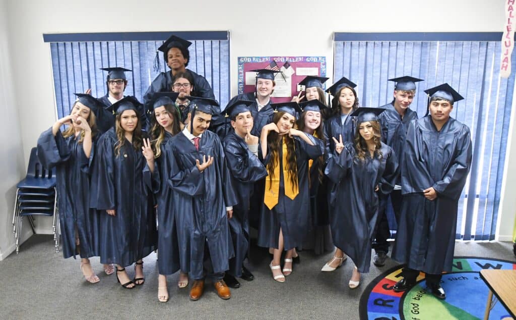 Photo - The Sherman Thomas Charter Schools class of 2022 high school graduates gather for a fun photo before commencement June 3.