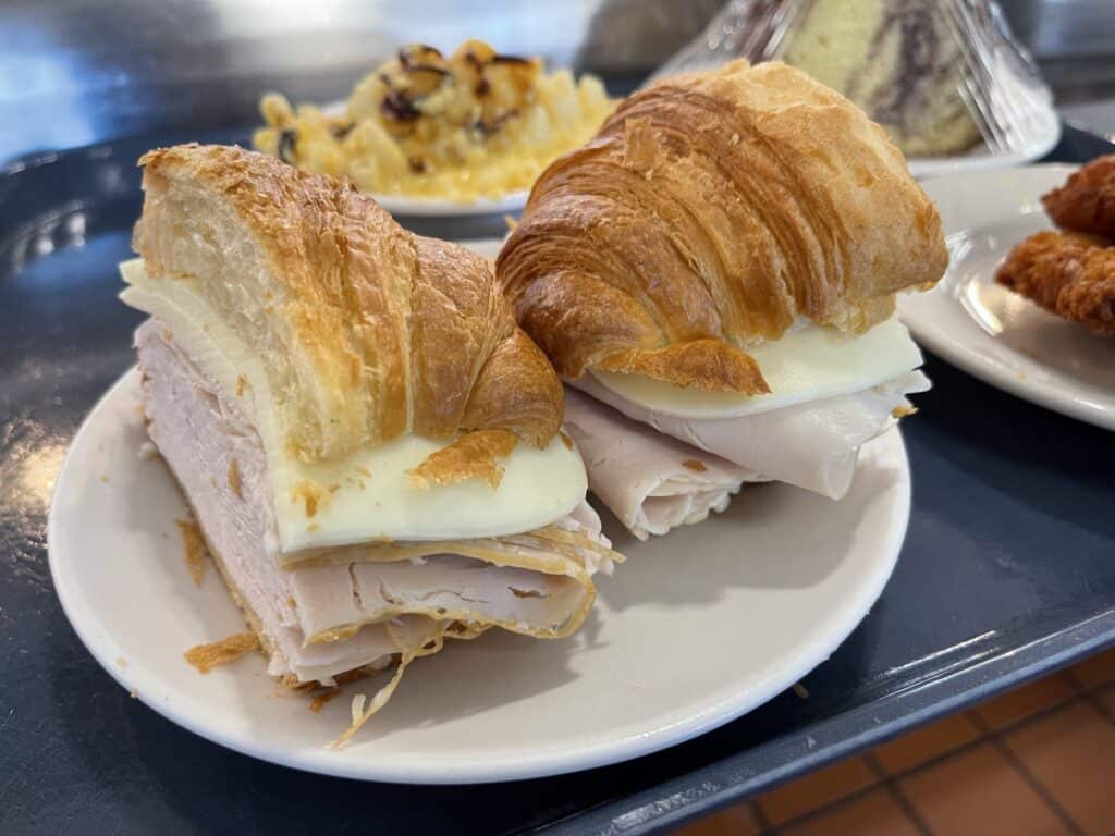 Turkey sandwich with croissants and egg, perfect for leftover turkey meals.
