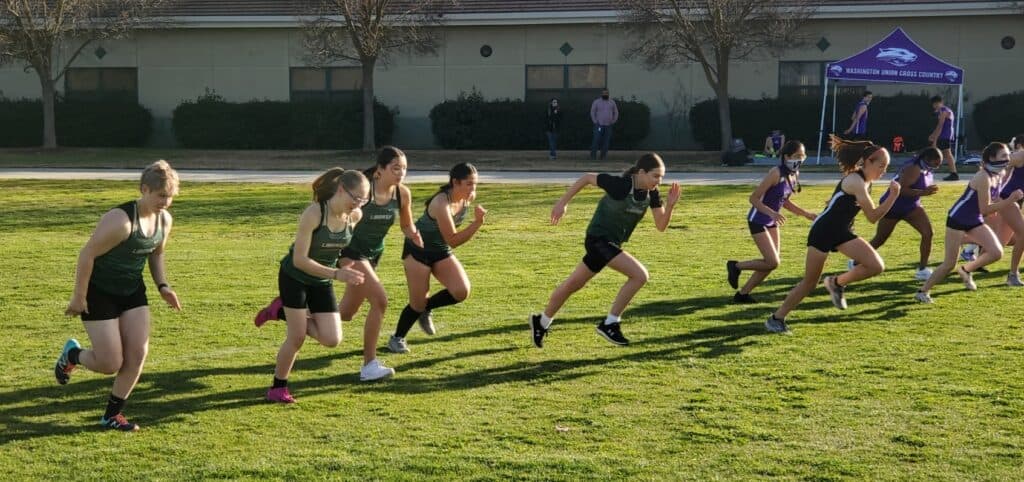 Girls running in a cross country race at Madera High School.