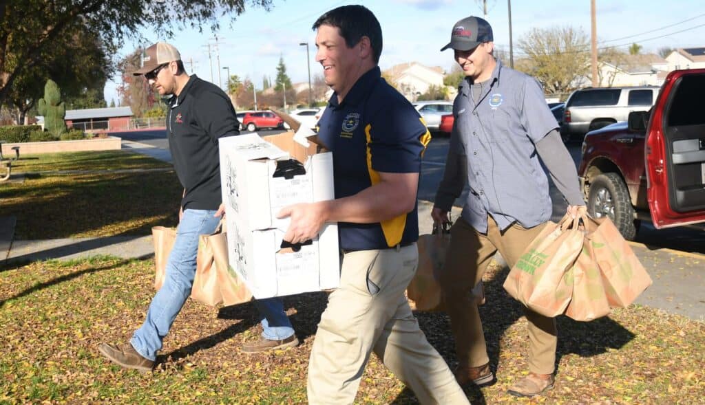 Community members delivering food donations in Madera.