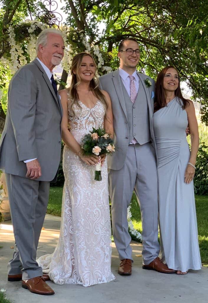Bride and groom exchange vows with family and friends present.
